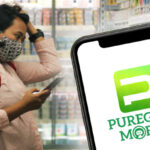 woman in grocery with Puregold Mobile app