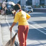 A street sweeper in Metro Manila, considered to be a minimum wage earner